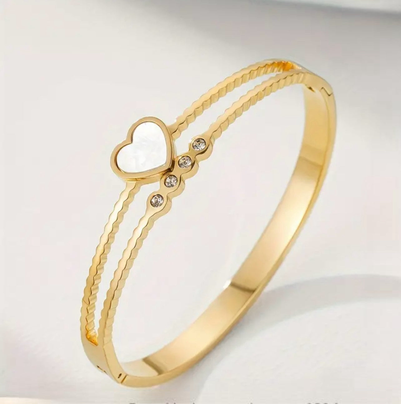 This Gold Plated Enamel Heart and Zirconia Bangle