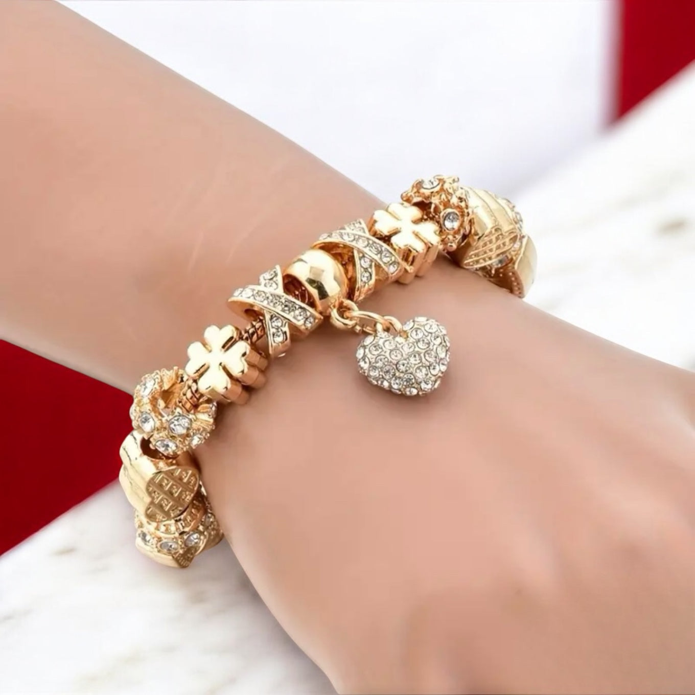 Eternal Glow: Gold Charm Bracelet with Zirconia Crater Pendants & Hanging Heart